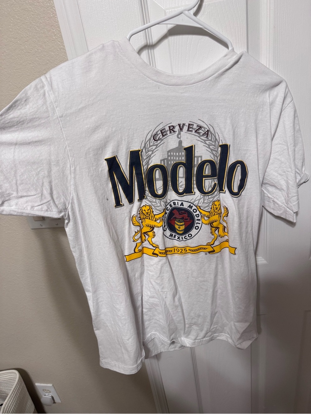 ModelCo White Graphic Tee with Navy and Gold Logo
